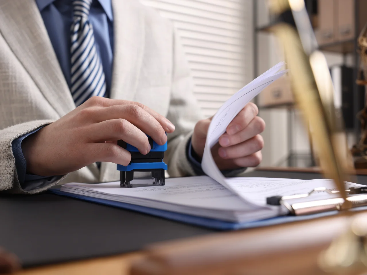 Professional reviewing and stamping Canadian documents for attestation and authentication.