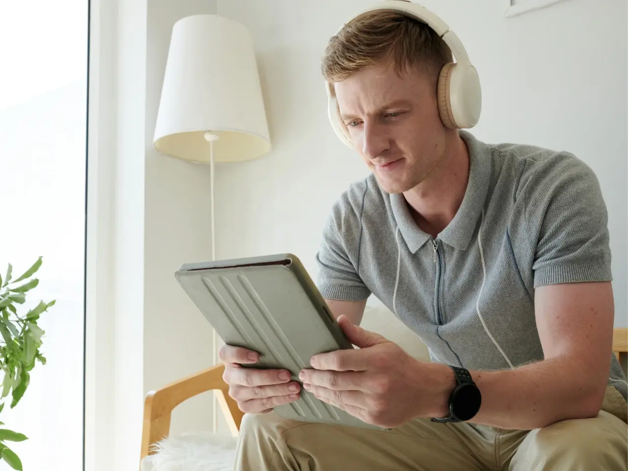 Person watching video with closed captions on a mobile device.