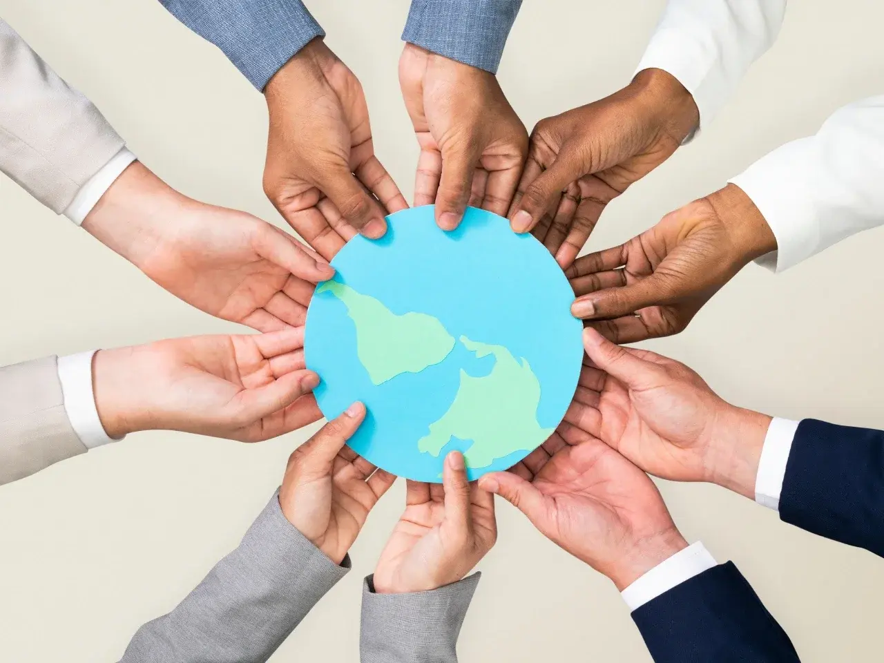 Hands holding a globe representing global language and dialect diversity.