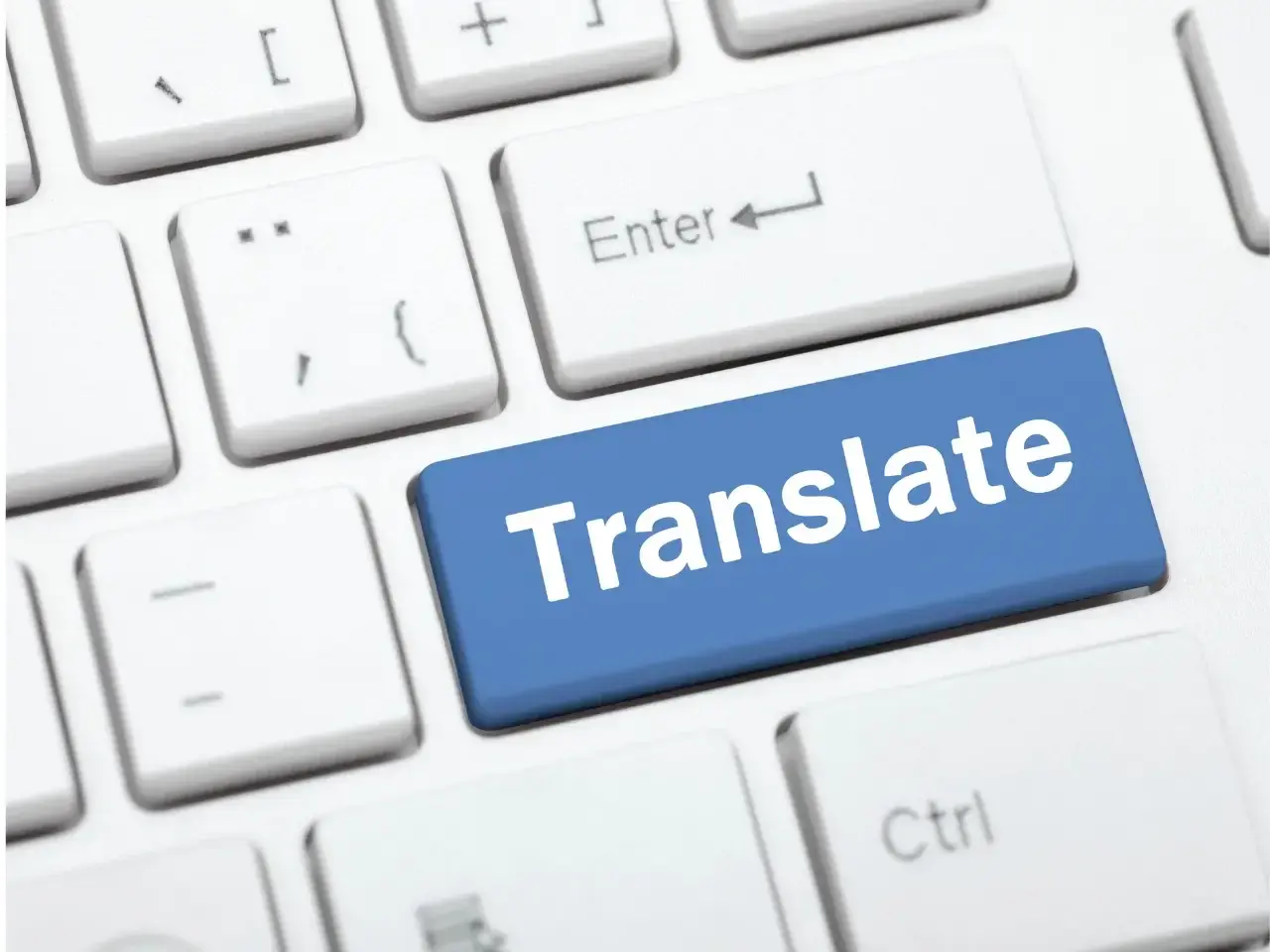 Translate button on keyboard representing translation for multilingual communication in Canada.
