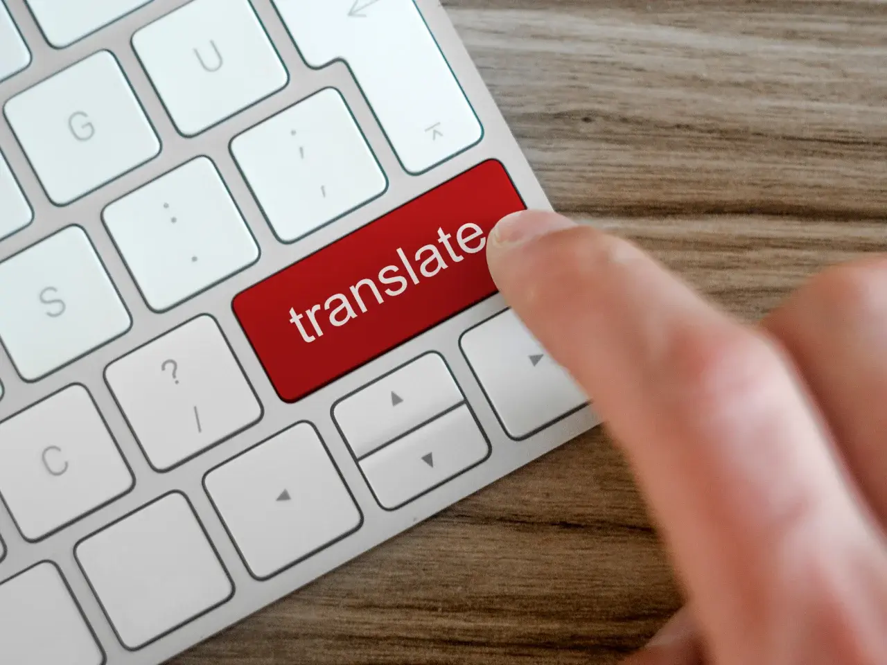 Keyboard “translate” button symbolizing when to rely on professional translators for higher accuracy.