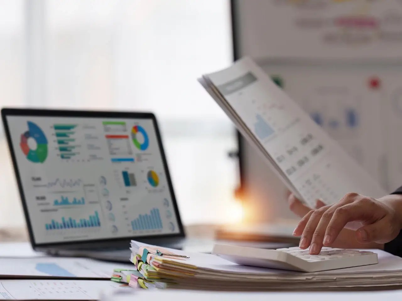Marketer reviewing analytics charts to identify target markets for international SEO research.