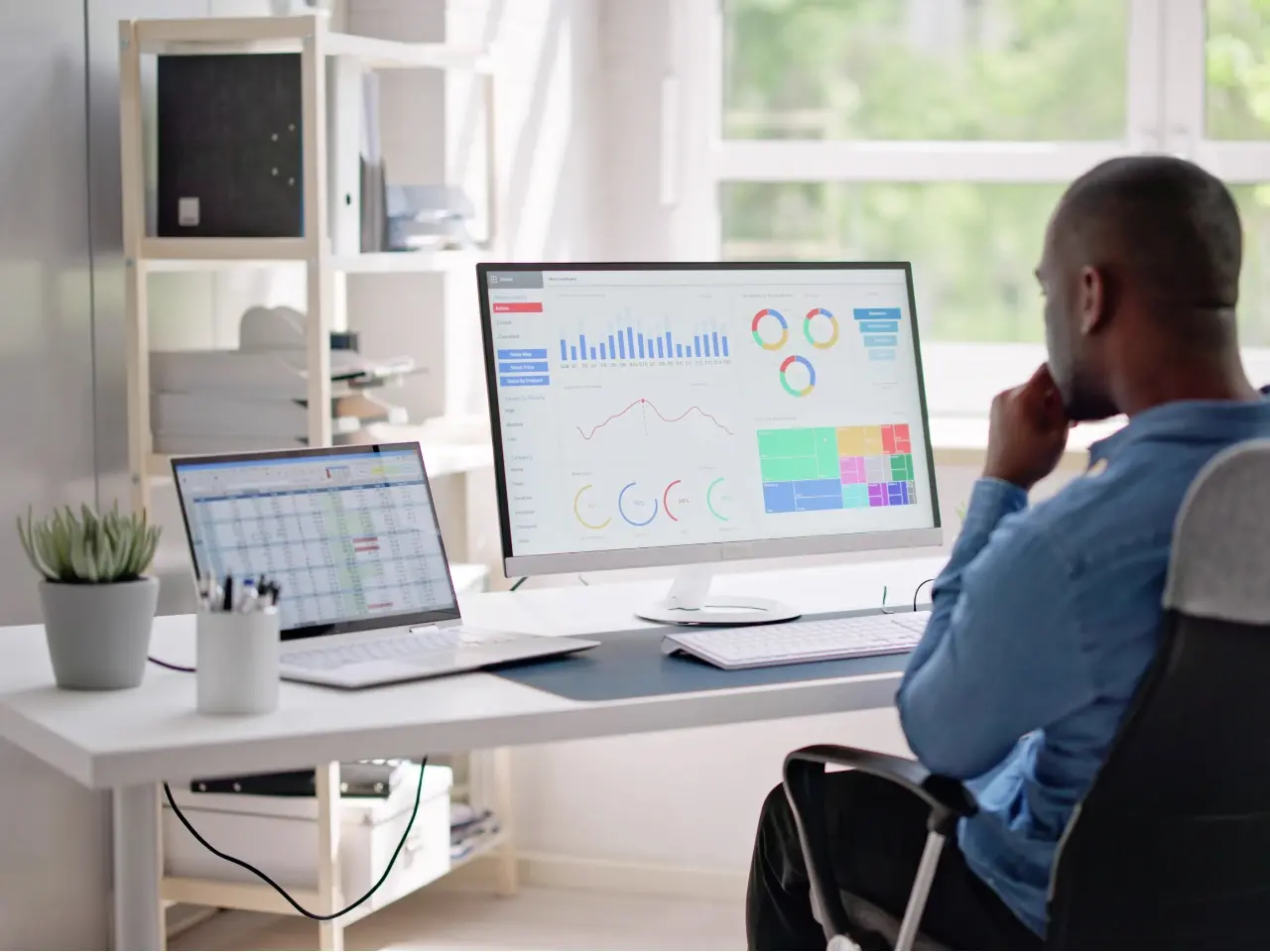 Analyst monitoring international SEO performance and KPIs across multiple regions on desktop screens.
