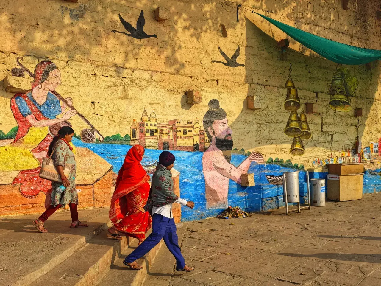 Street art and public life reflecting local language use in Indian communities.