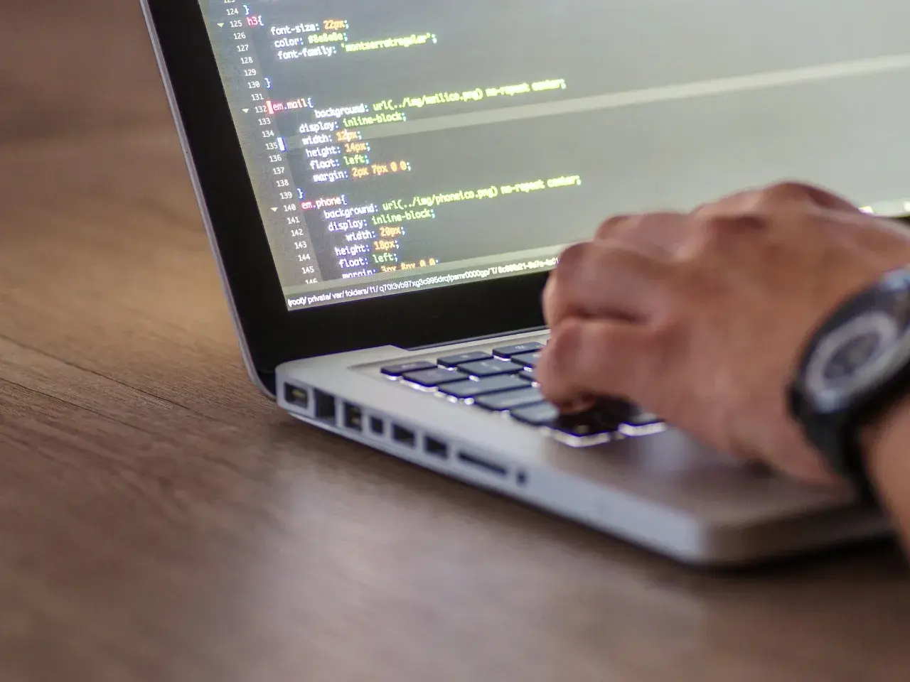 Developer working on website code to implement hreflang correctly.