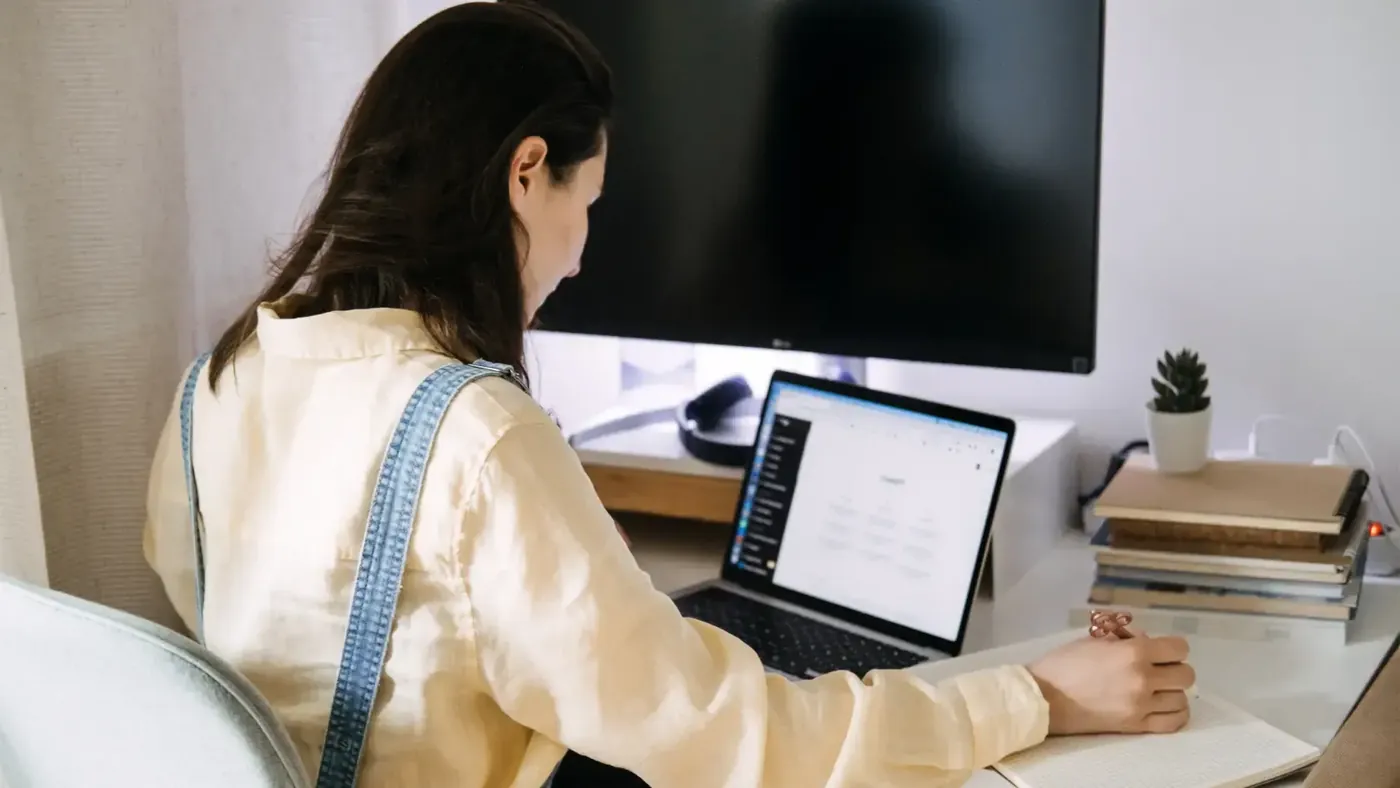 Business professional reviewing multilingual website content using AI-assisted translation tools.