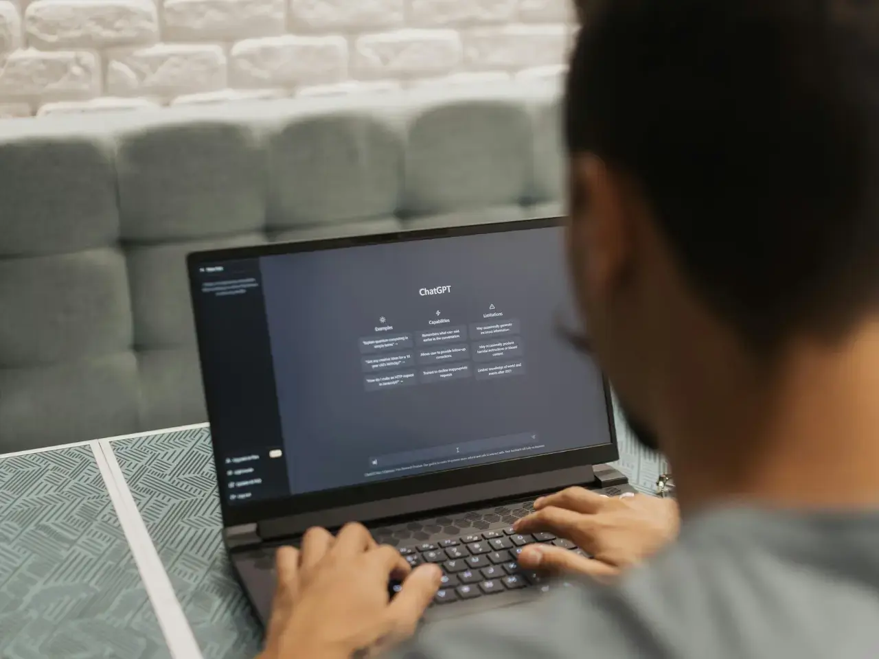 Website editor reviewing ChatGPT translated content on a laptop screen for accuracy and consistency.