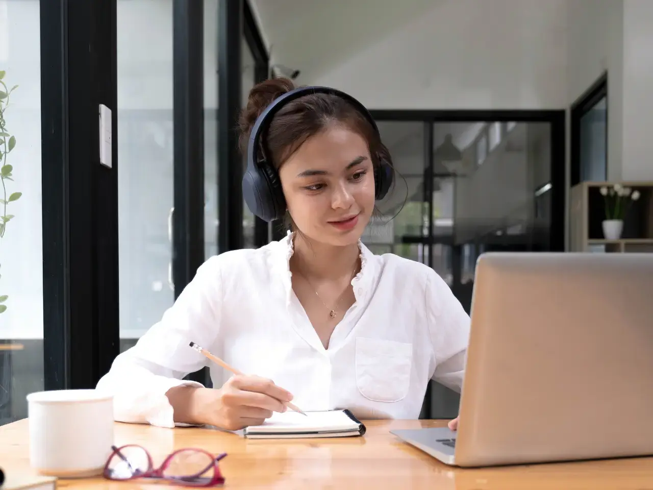Professional using ChatGPT-style AI to draft translated content for business use.