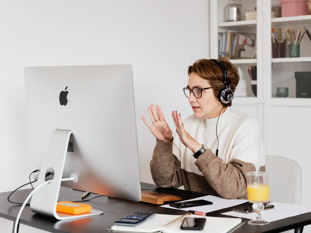 A person on a video call reviews website content, showing how to translate and localize it so it works across multilingual pages.