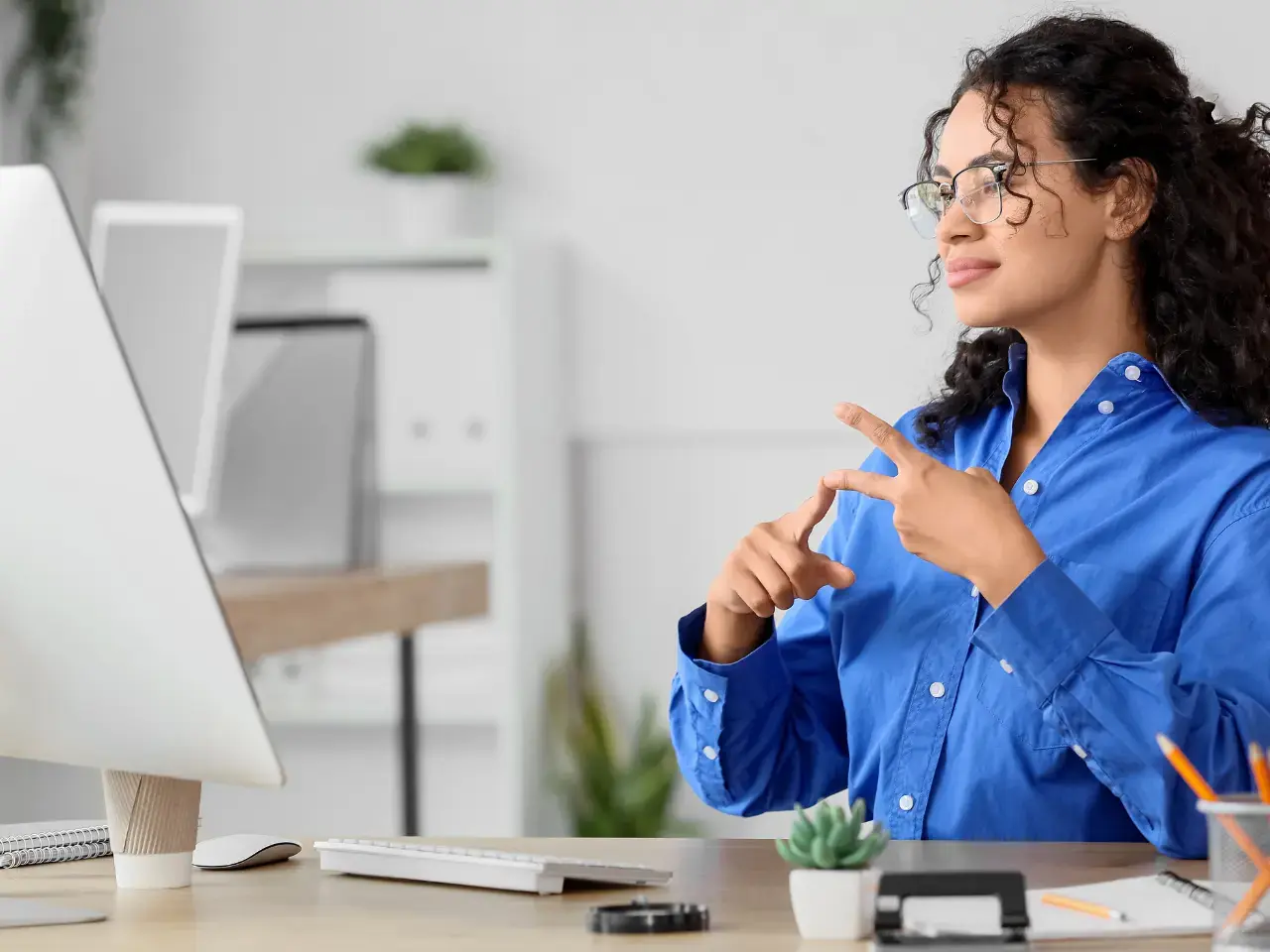 Consultant on a video call, assisting with multilingual website setup and translation support.