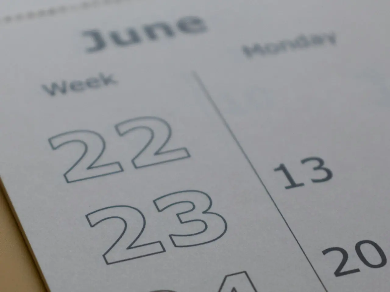Close-up of a June calendar highlighting important dates, representing key implementation deadlines for Quebec’s Bill 96 French language requirements.