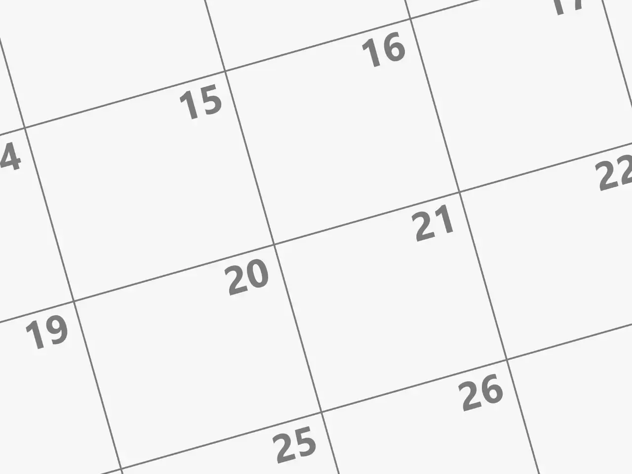 Close-up of a calendar with dates highlighted, symbolizing important deadlines for Quebec language law compliance.