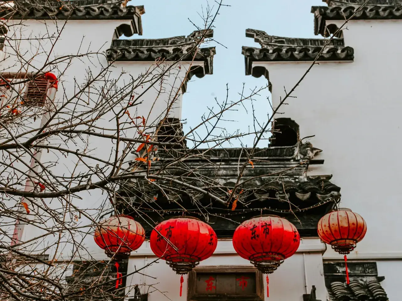 Traditional Chinese-style building with red lanterns, representing Chinese-speaking markets.