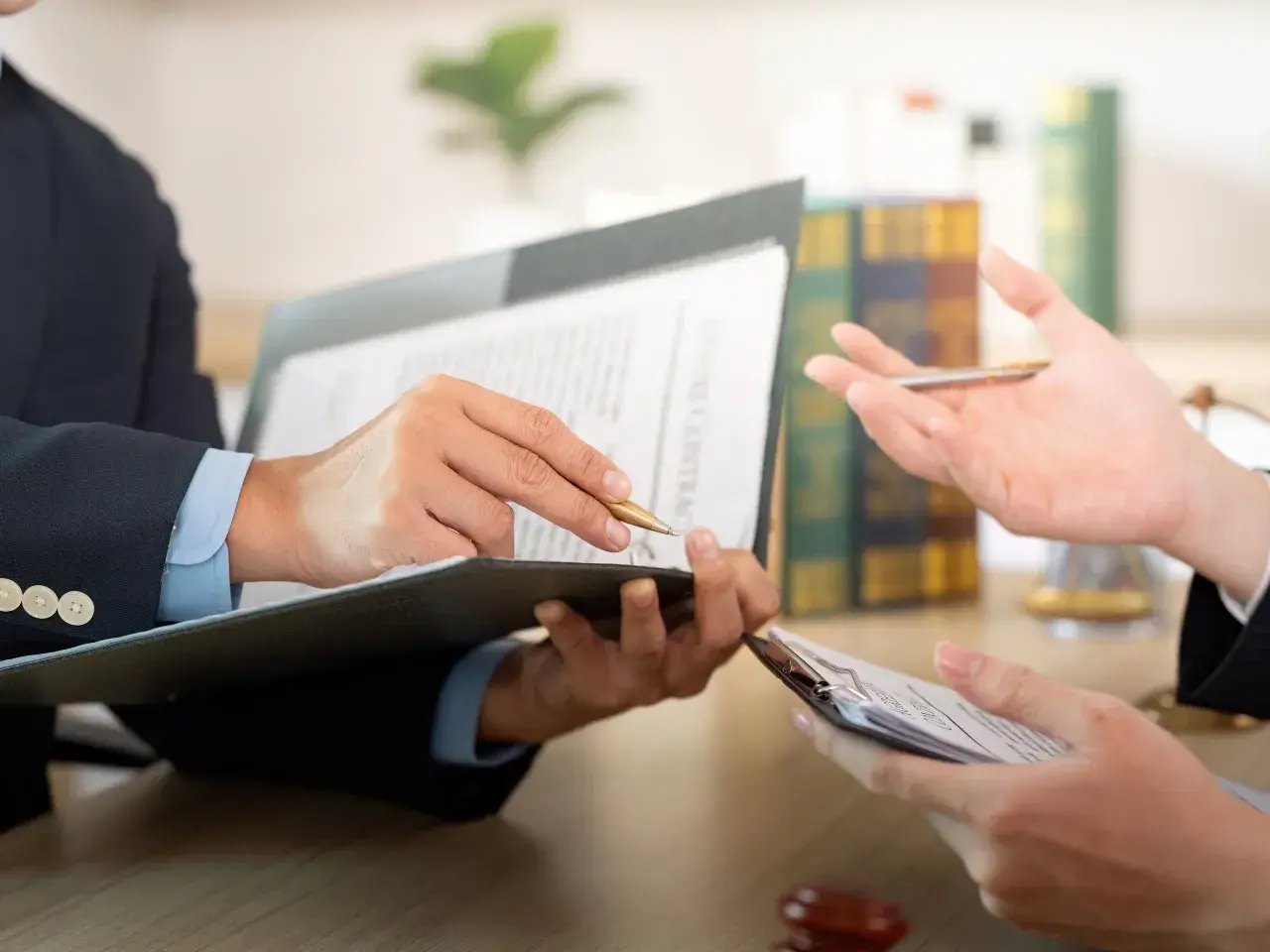 Business professional reviewing and signing documents.