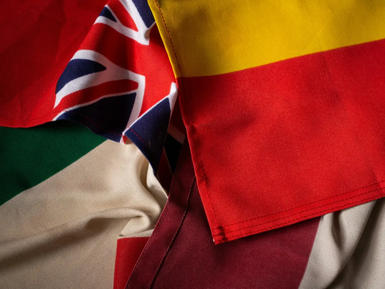Flags representing multiculturalism and linguistic diversity beyond English and French in Canada.