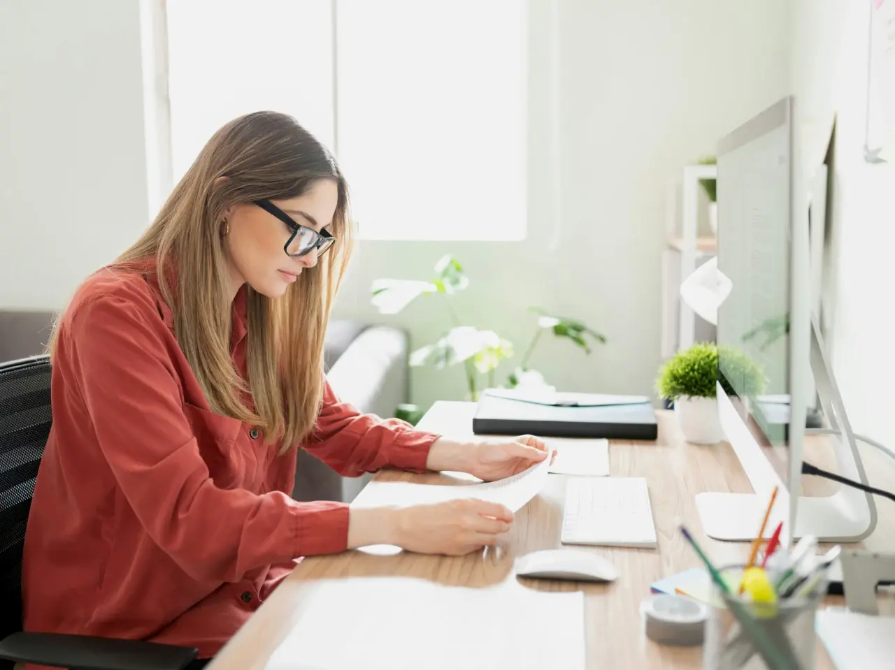 Professional translator working at a desk, ensuring that the translation accuracy meets Canada’s language standards.