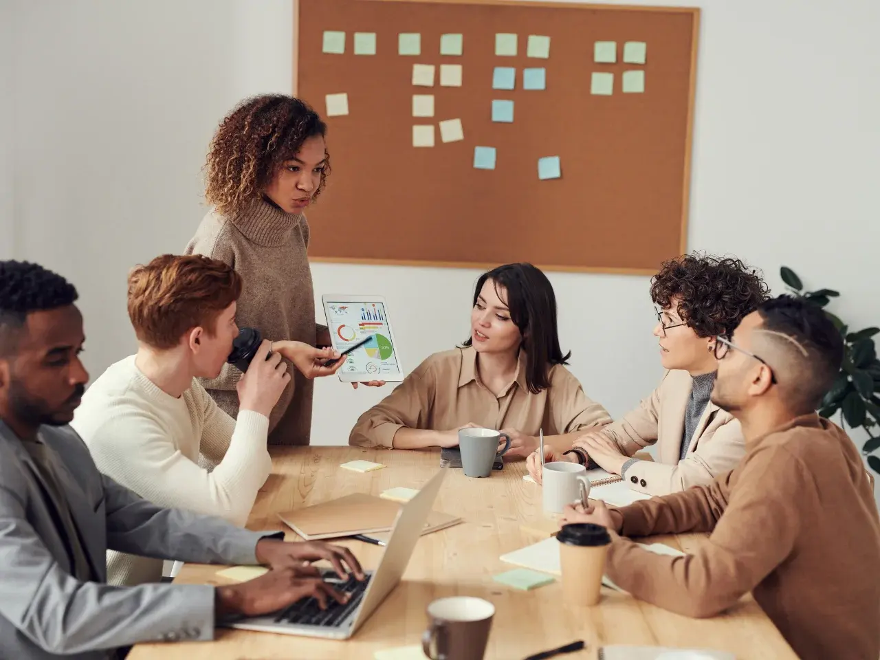 Diverse employees brainstorming ideas in a modern global office environment.