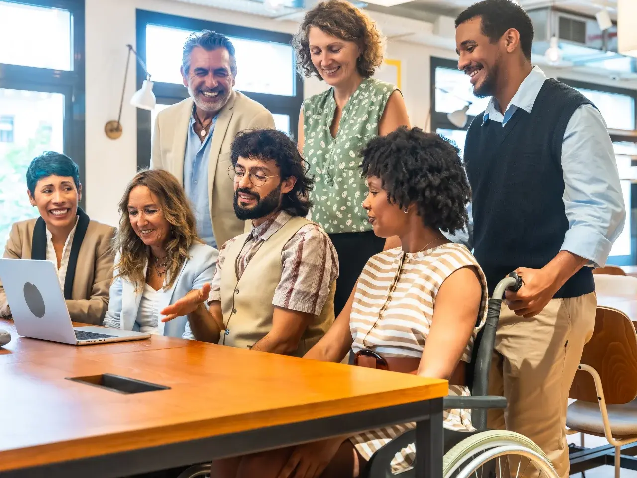 Inclusive workplace with employees from different ethnicities collaborating together.