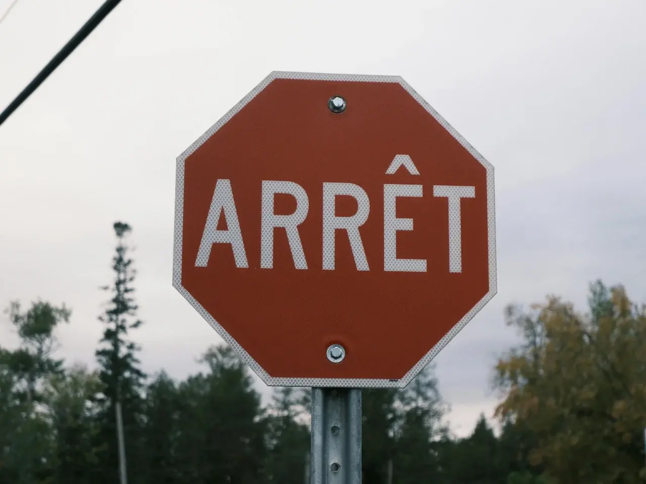 Montreal street sign in French representing Quebec’s francophone culture and language policies.