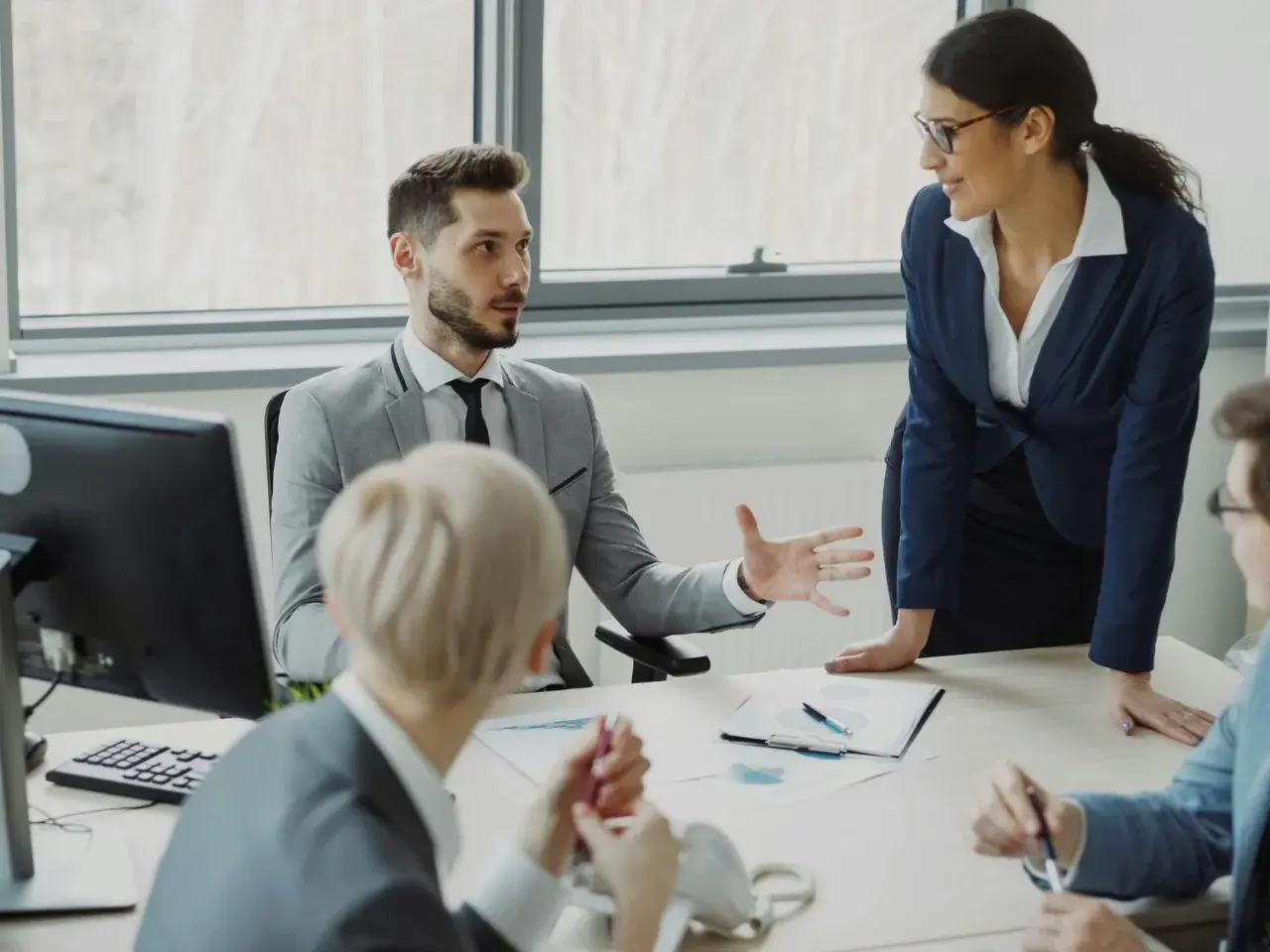 Diverse professionals in Toronto speaking multiple languages in a business setting.