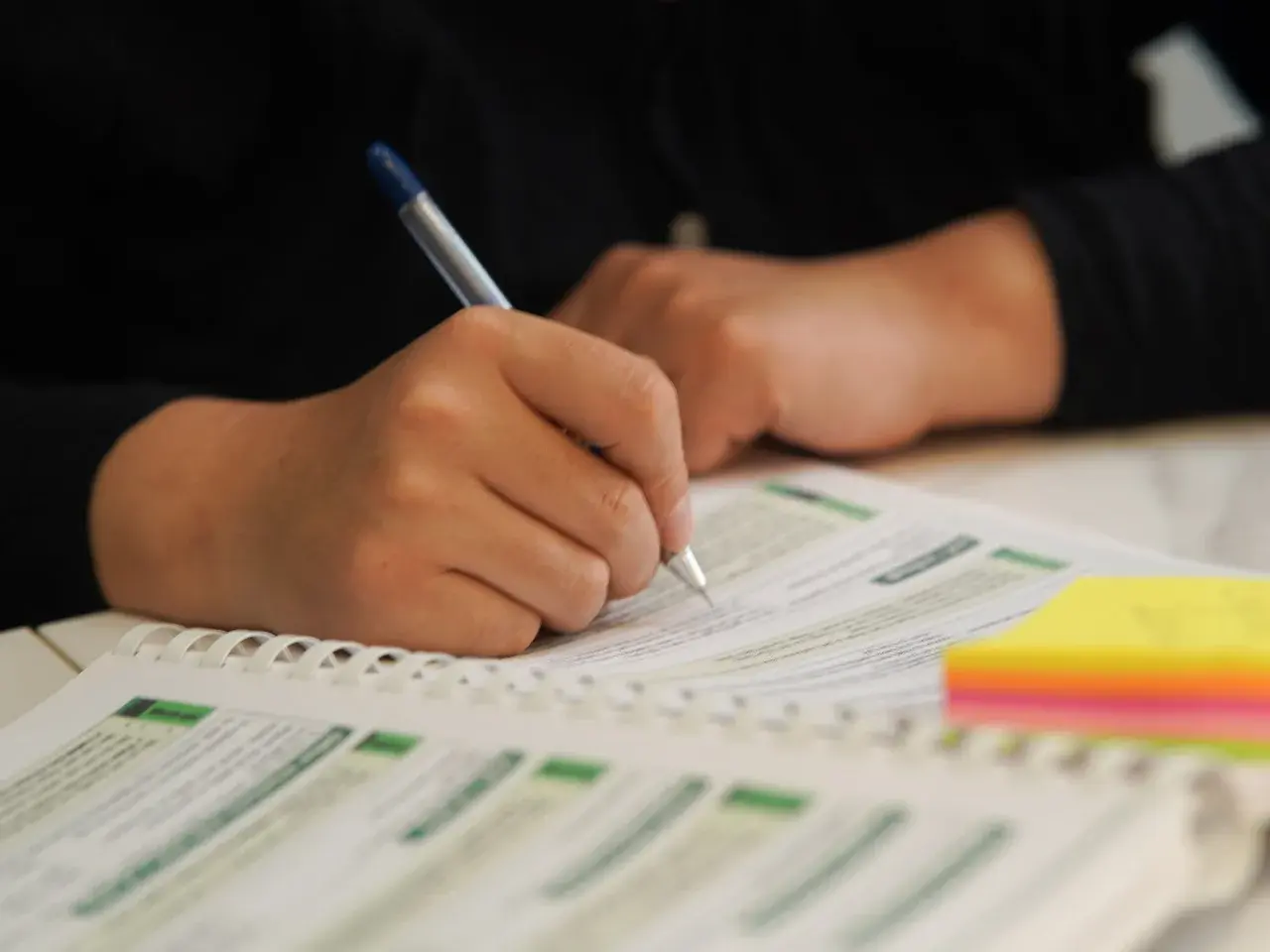 Professional Canadian translation team reviewing multilingual business documents and certified translations.
