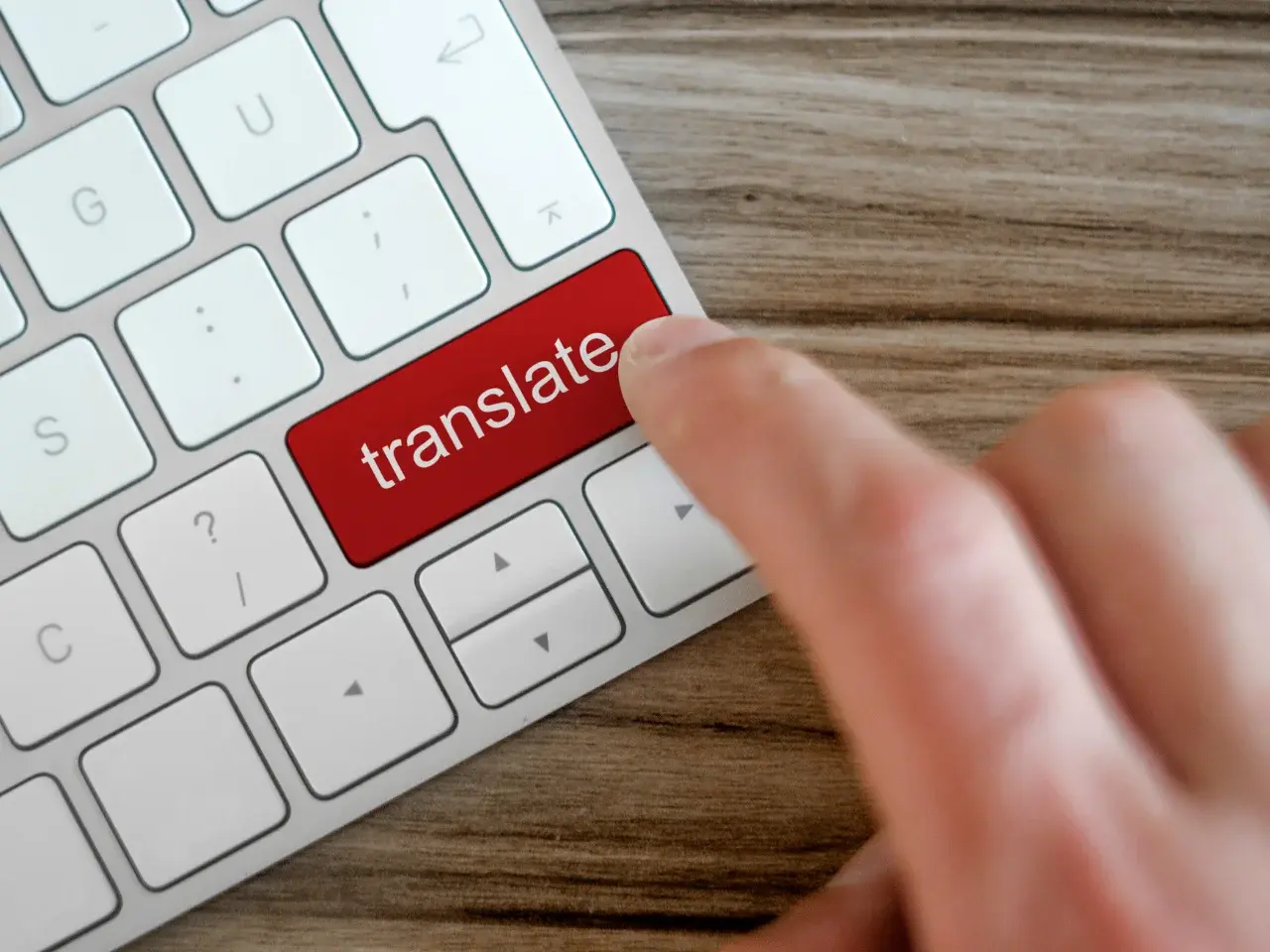 Human translator refining AI-generated multilingual business translation.