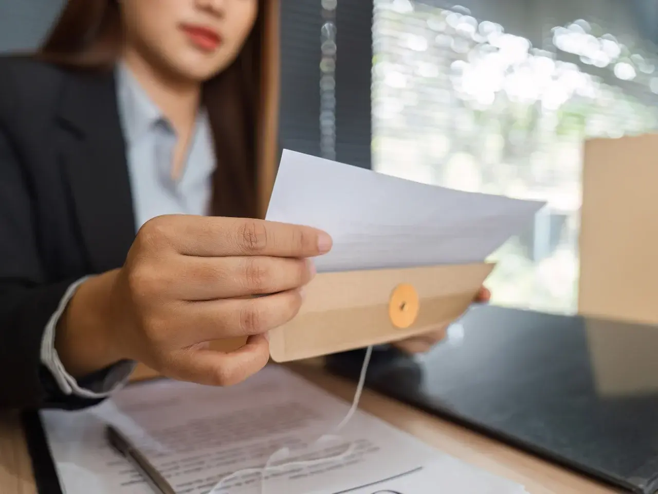 Certified translator reviewing legal and technical documents for international business use.