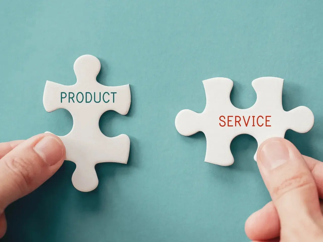 Puzzle pieces labelled product and service symbolizing localization in business.