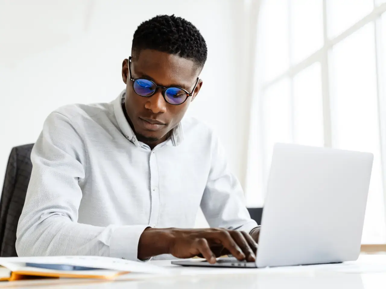 Professional translator analyzing machine translation quality and identifying errors for post-editing.
