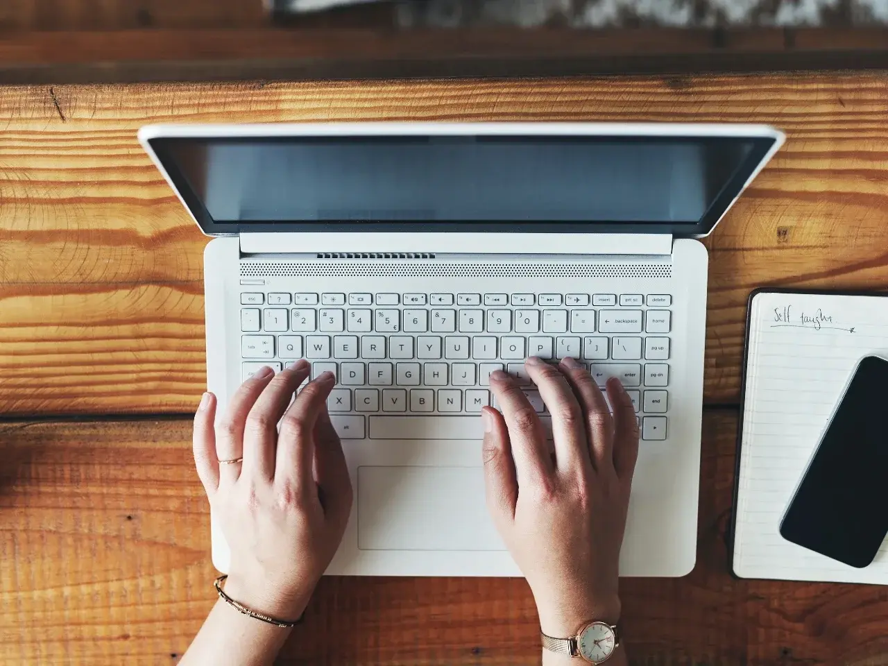Typing spoken language into written text during transcription.