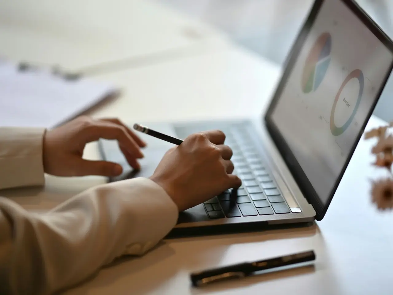 Person analyzing charts on a laptop screen, representing a comparative feature matrix of Canadian search engines.