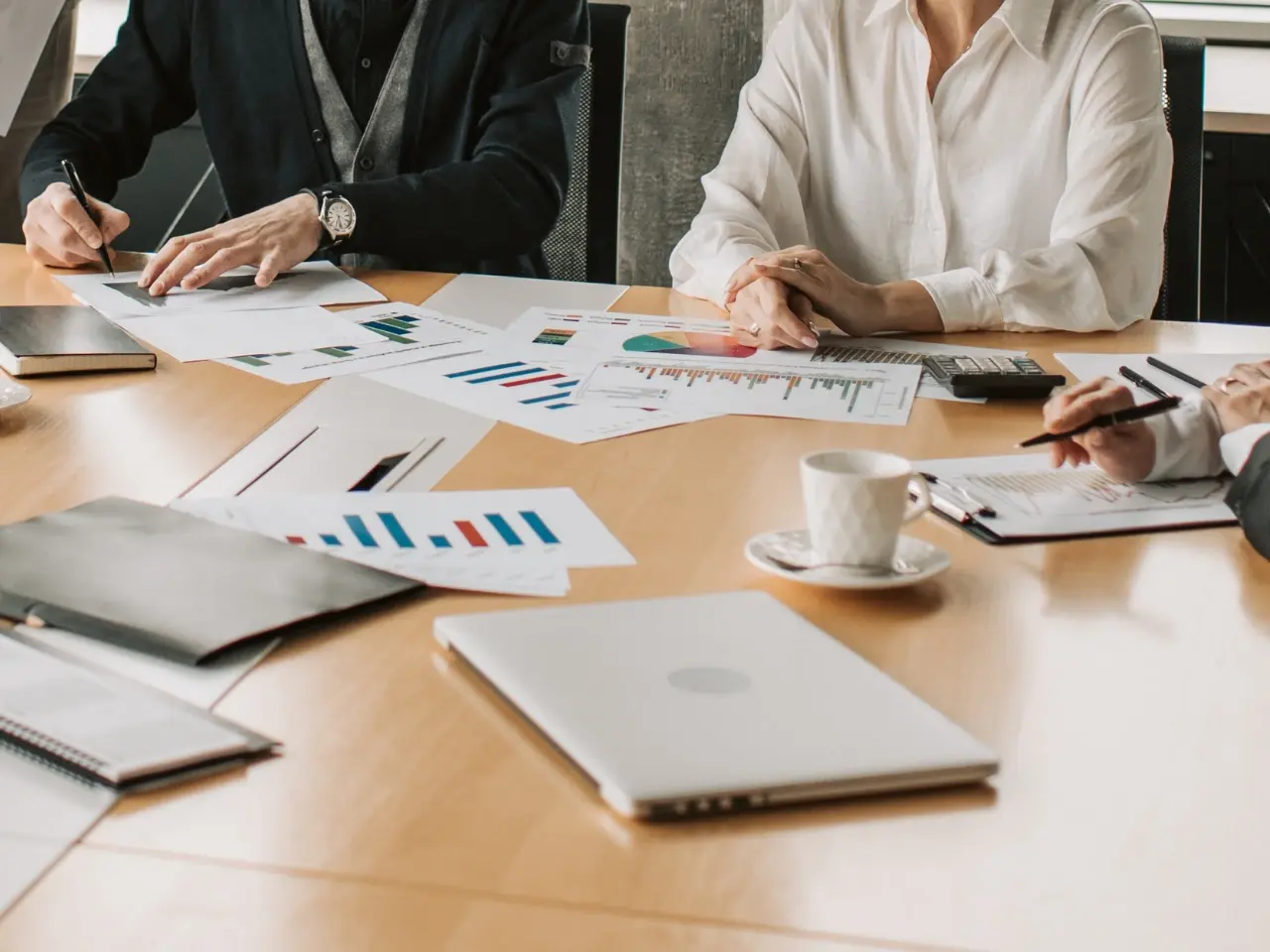 Professionals analyzing charts and content strategy for effective transcreation.