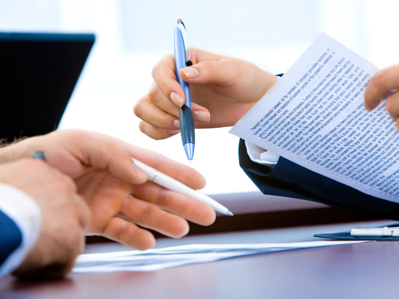 Professionals reviewing and preparing corporate documents for a Canadian immigration application.