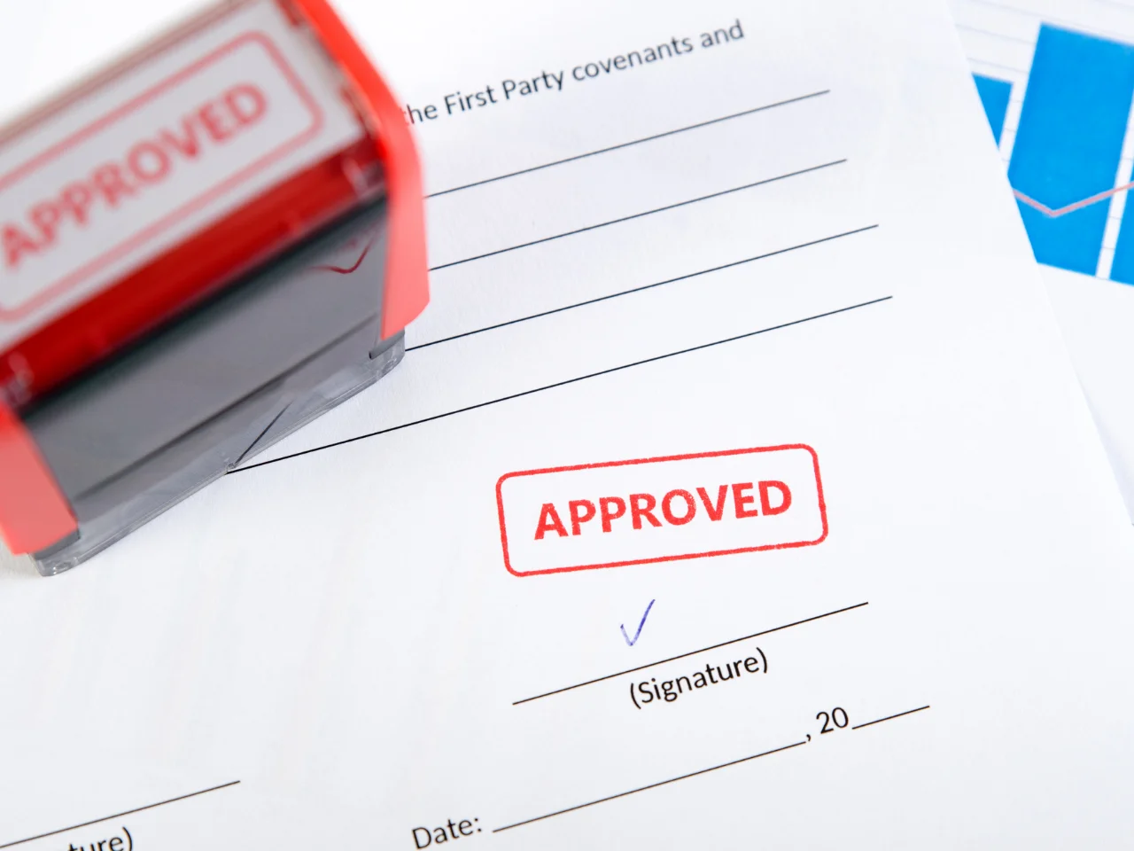 Approved business document with official stamp and signature.