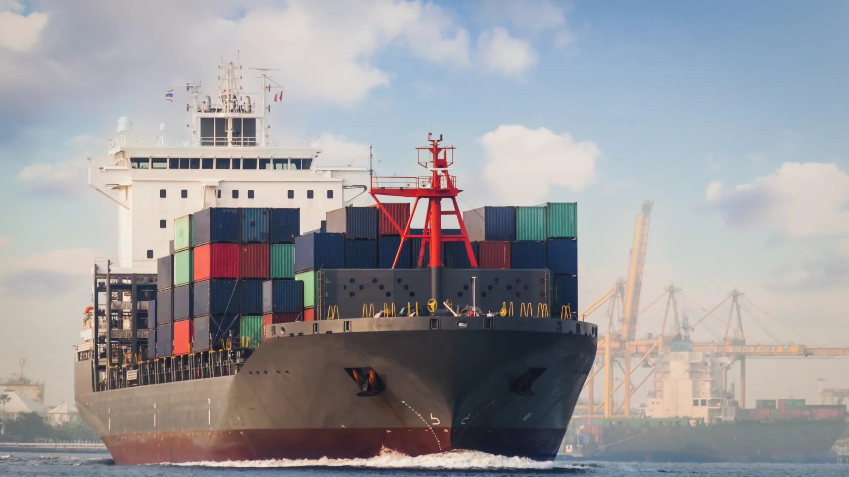 Container cargo ship transporting export goods from Canada for international trade and certificate of origin compliance.