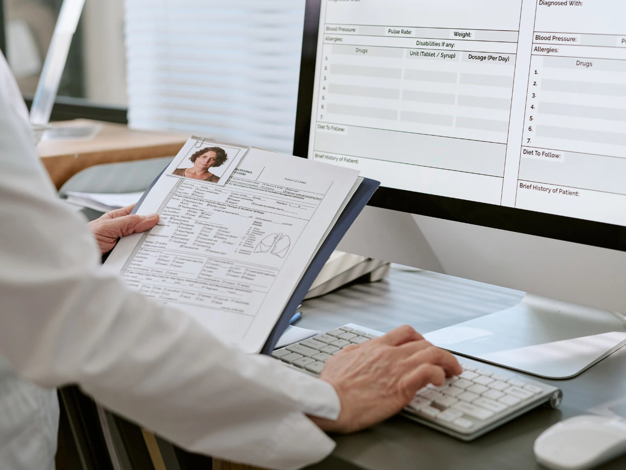Professional reviewing employment agreement terms and supporting documents.