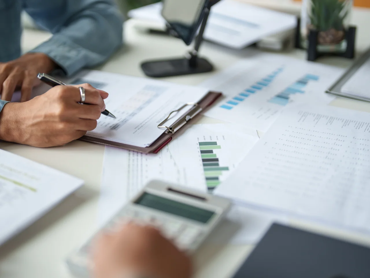 Business professional reviewing financial documents and business expenses in Canada.