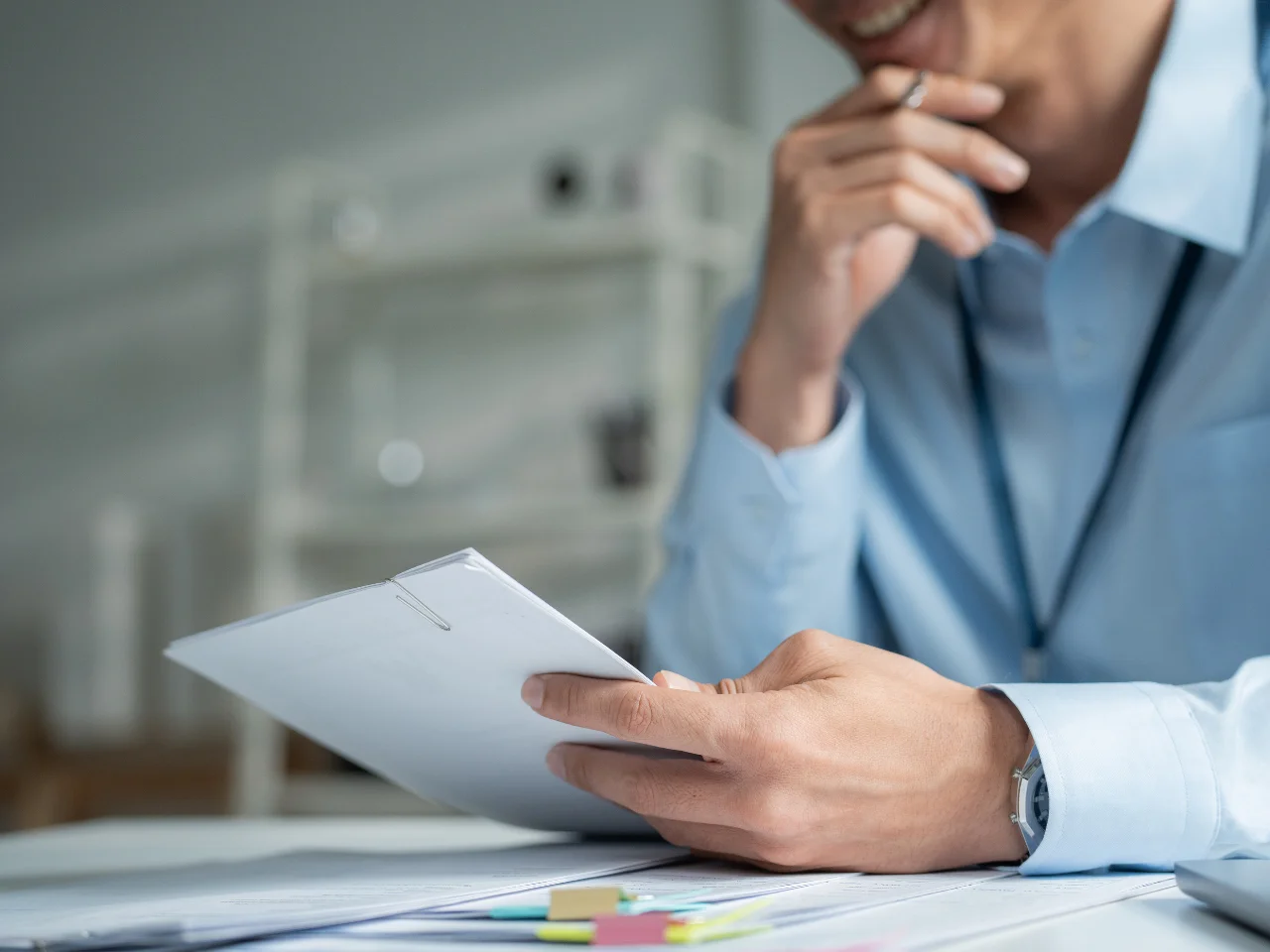 Business professional reviewing documents for non-resident business registration in Canada.