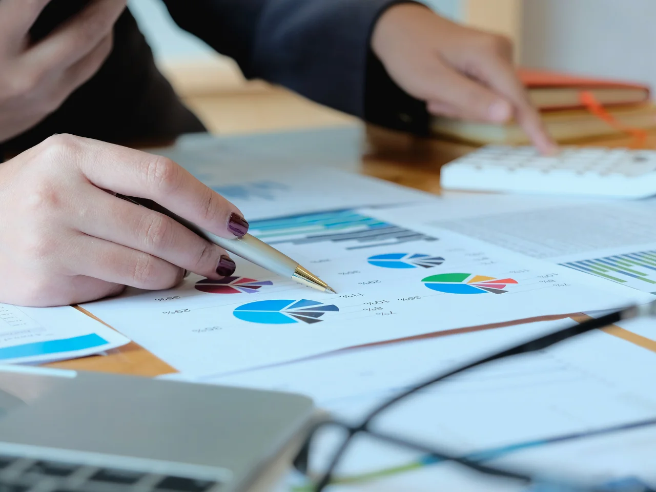 Business professional reviewing financial records and sales information for Canadian business activity.
