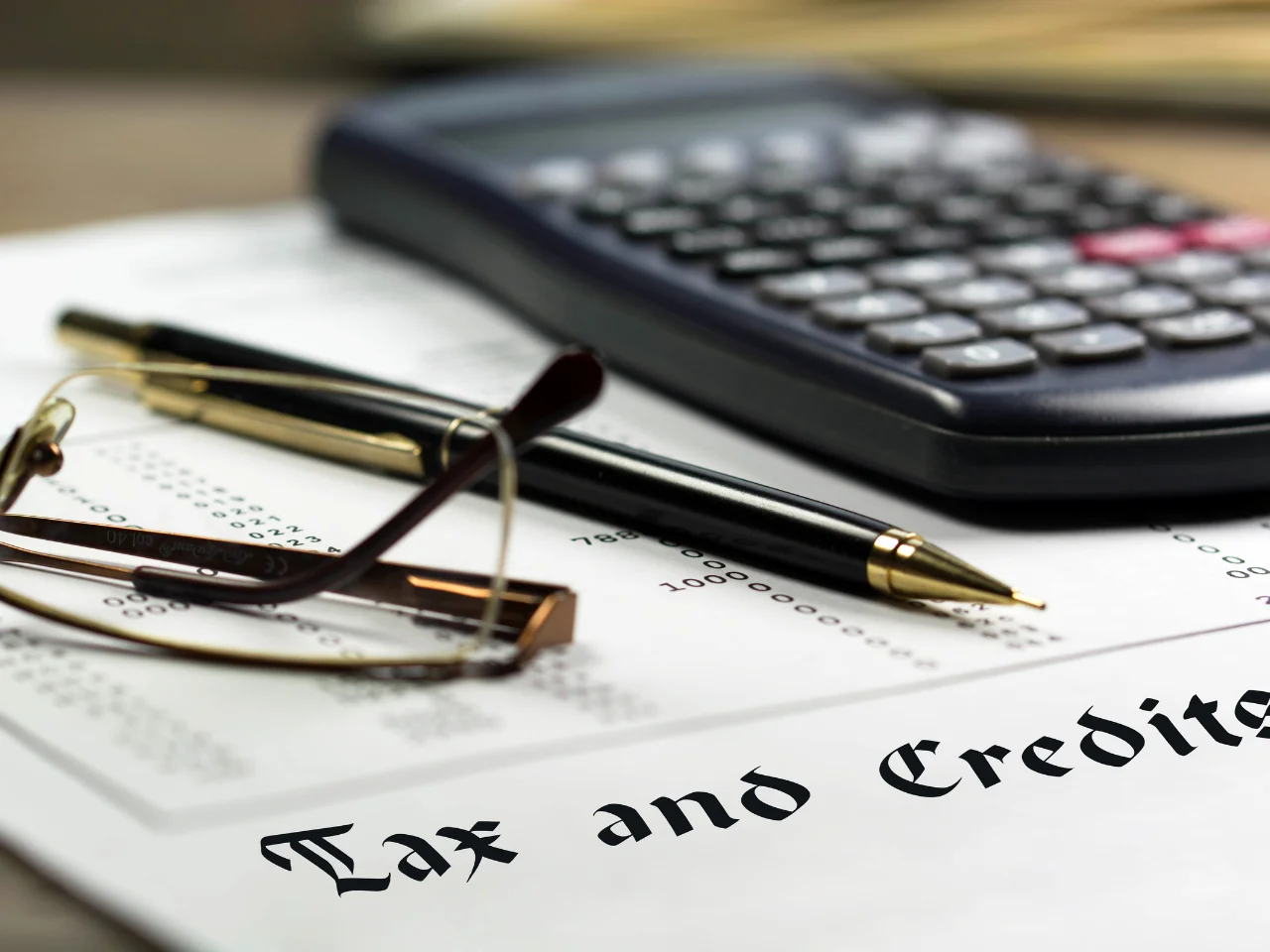 Business professional reviewing tax documents and records for GST/HST registration and input tax credits.