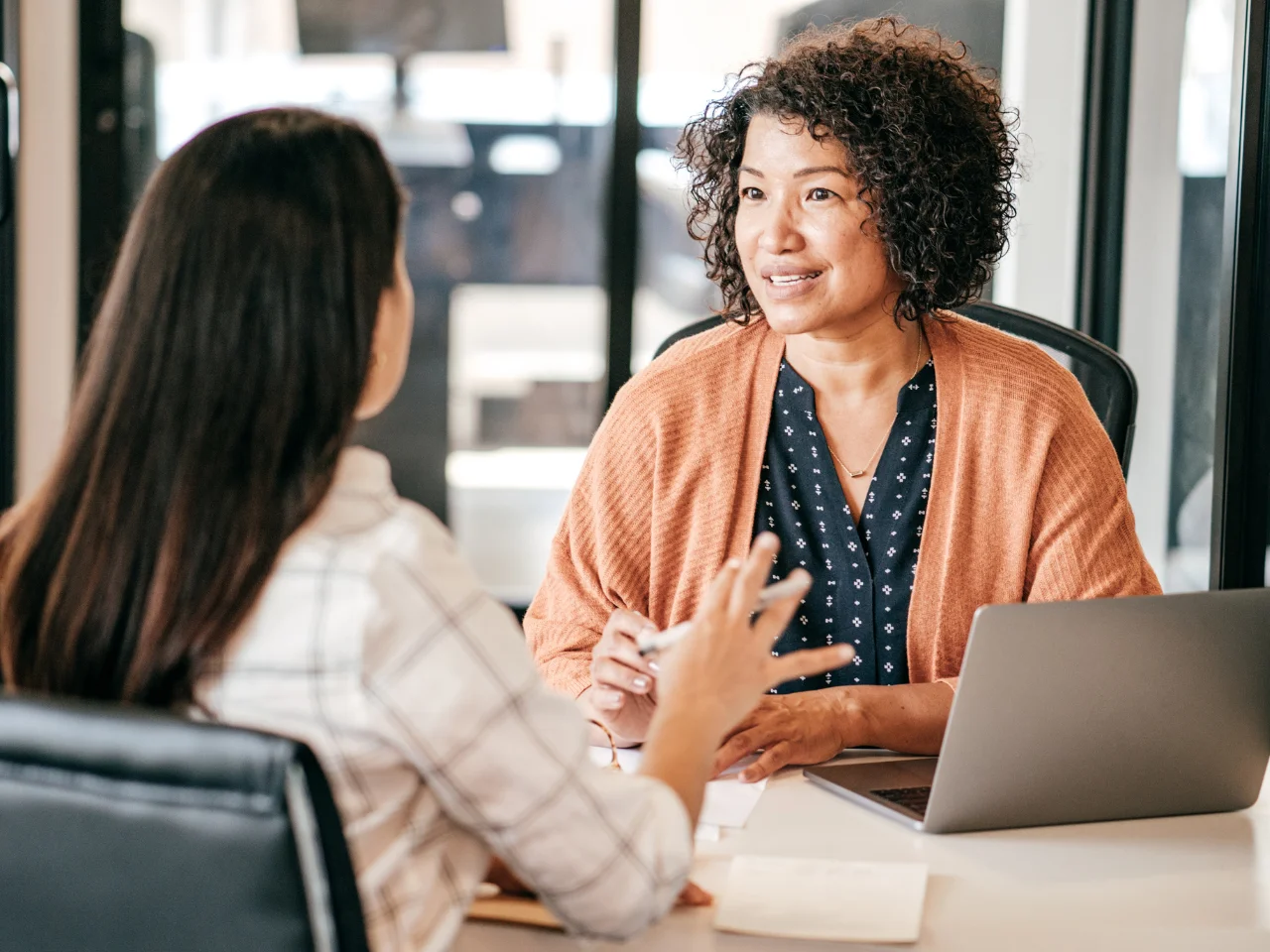 Employer discussing a foreign worker position and employment requirements with a candidate.