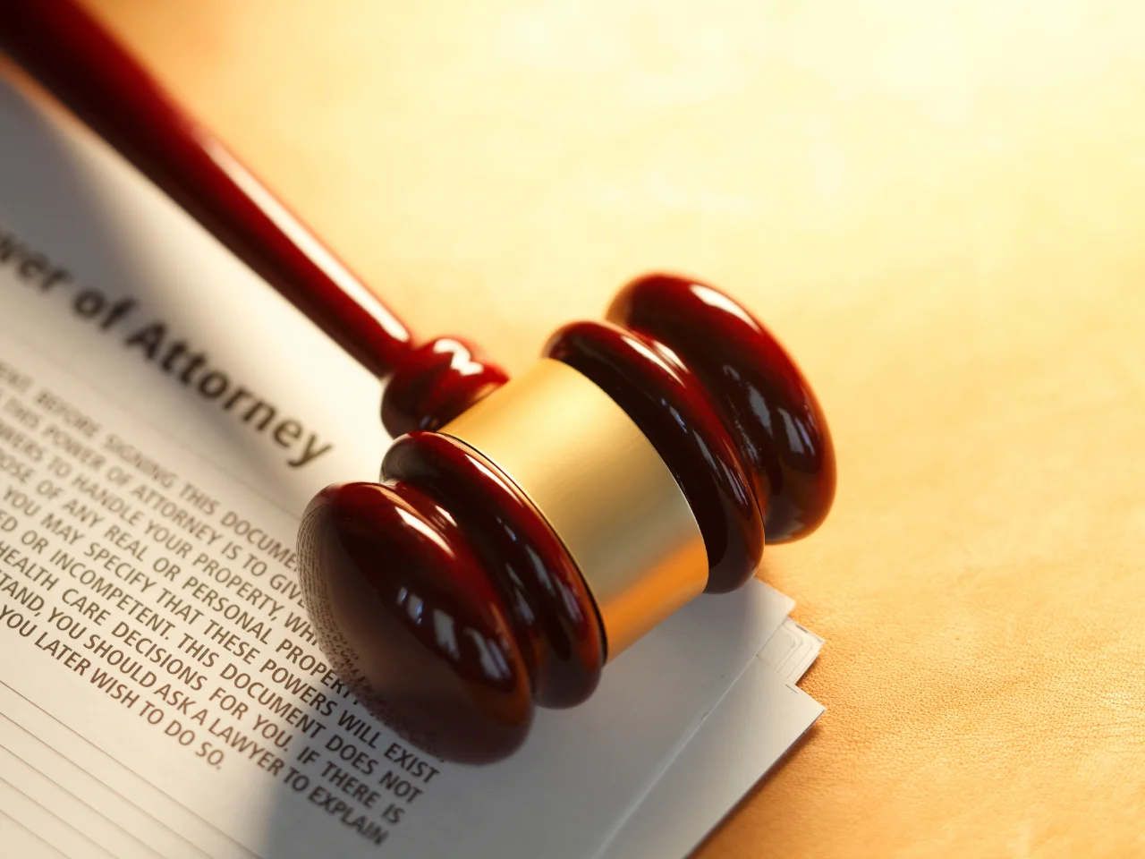 Legal gavel placed on a power of attorney document representing notarization, apostille, and international legal authority.