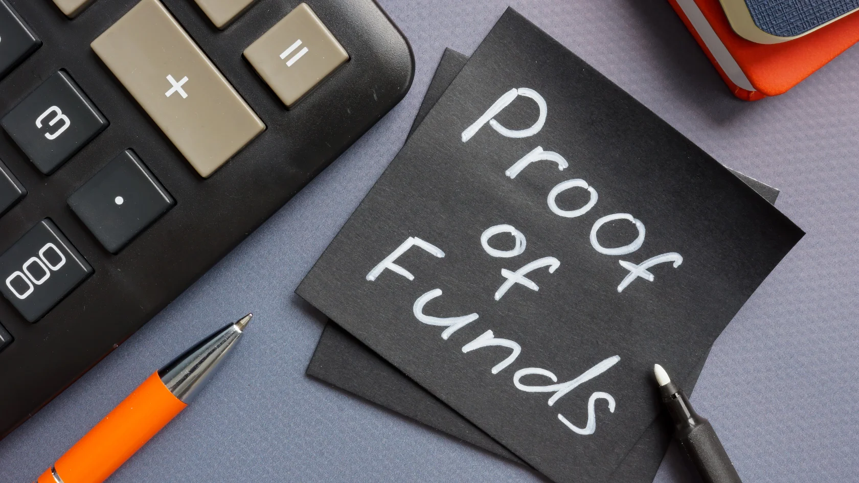 Calculator and note displaying proof of funds for Canada Express Entry application.