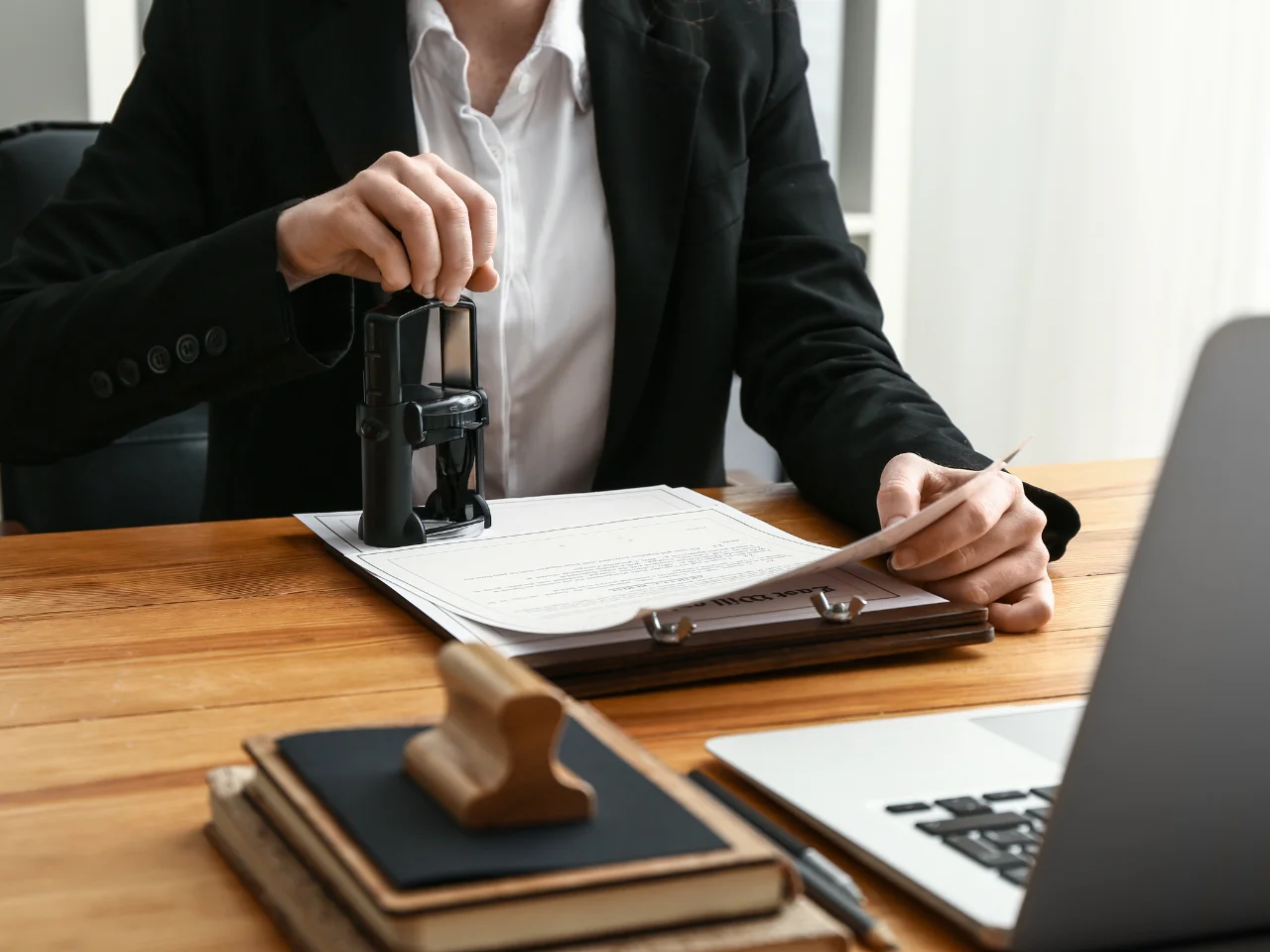 A professional stamping certified documents for apostille and document legalization in Canada.
