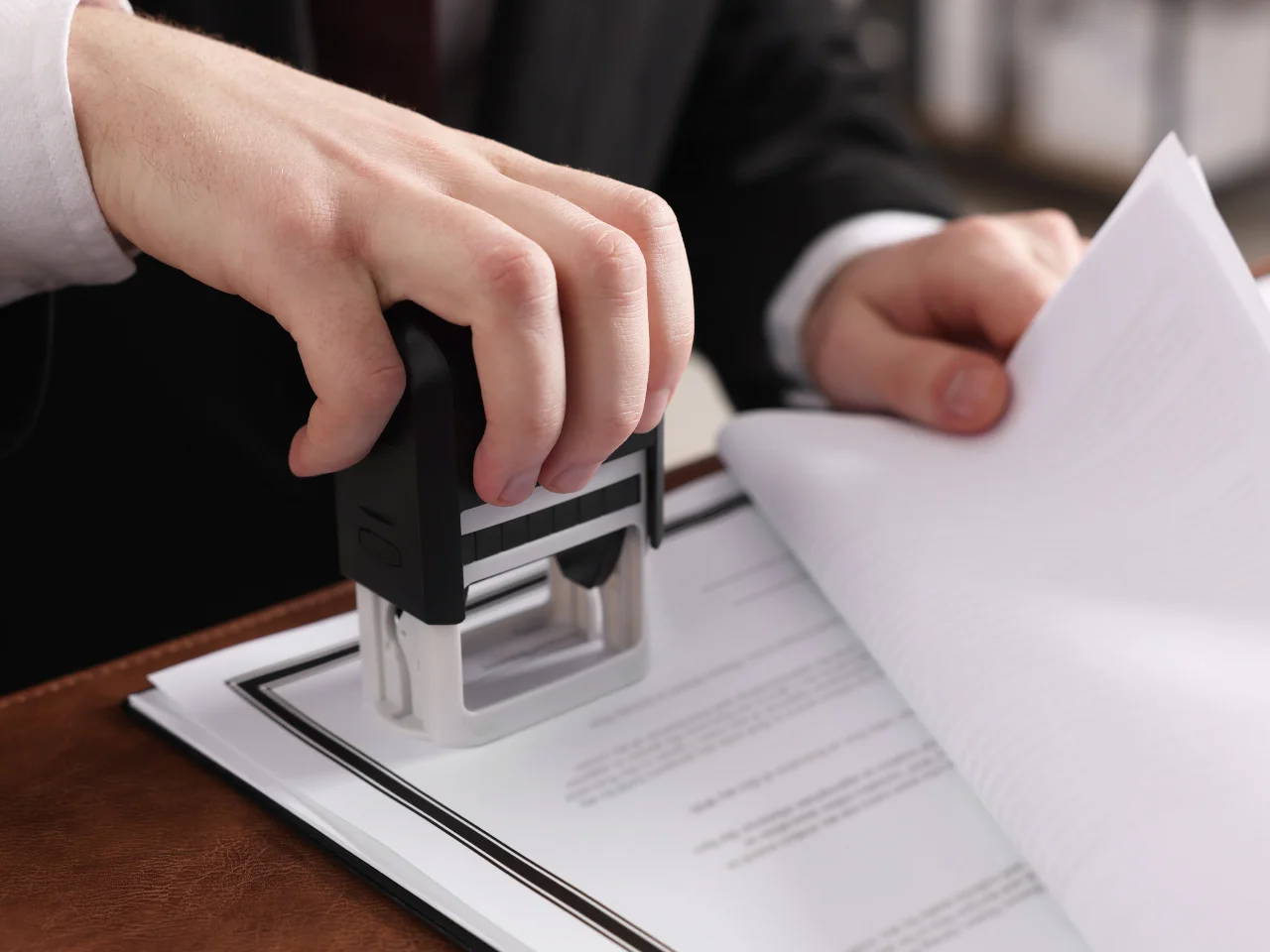 Notary public stamping a single status affidavit for international use.