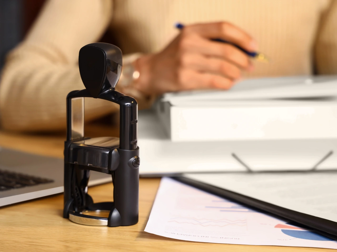Notary public preparing to certify an official document with a notarial seal